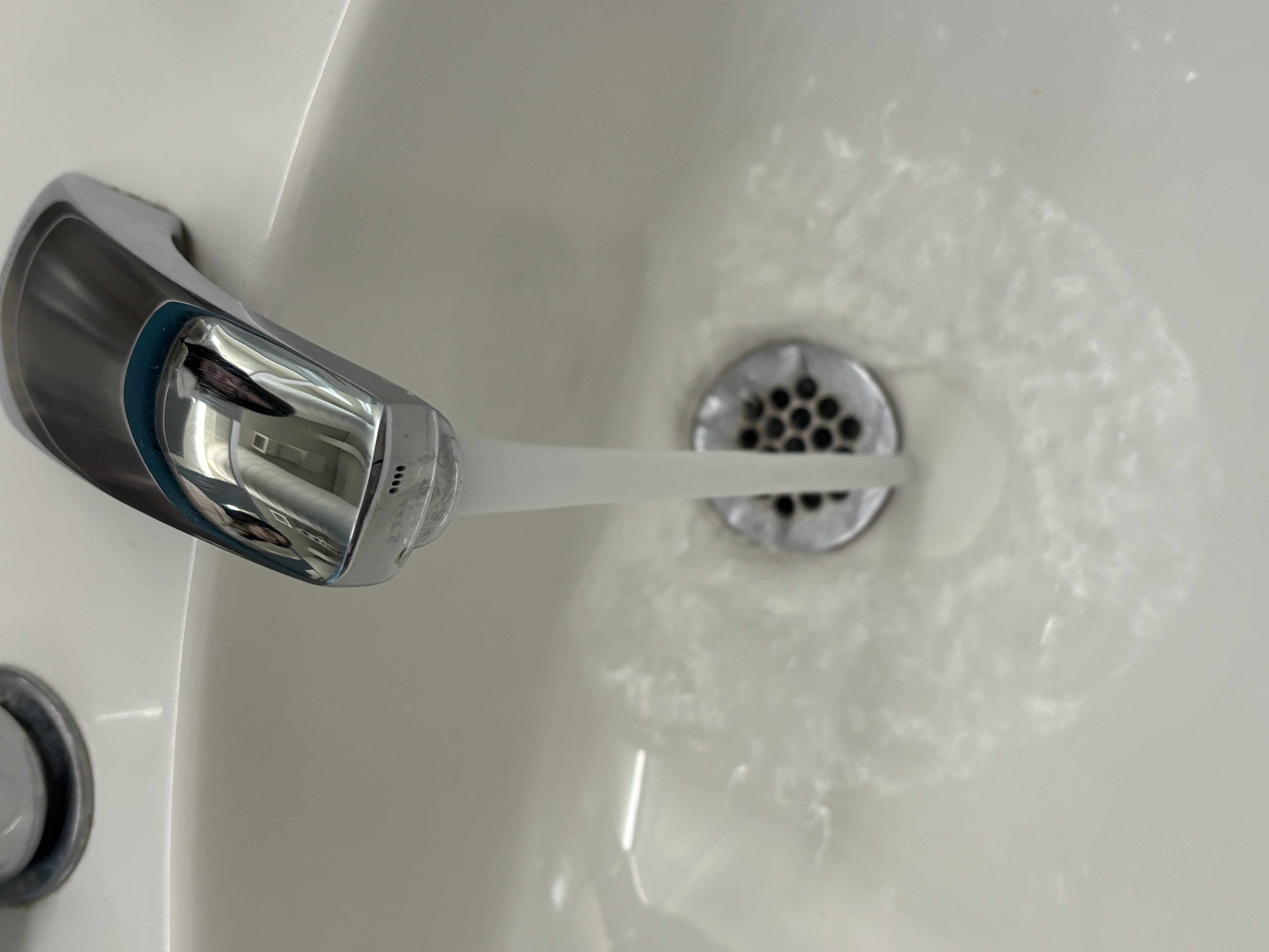 The sound of faucet pouring water